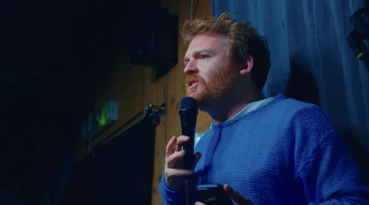 Close-up filming angle of a comedian performing at Backstreet Comedy Club
